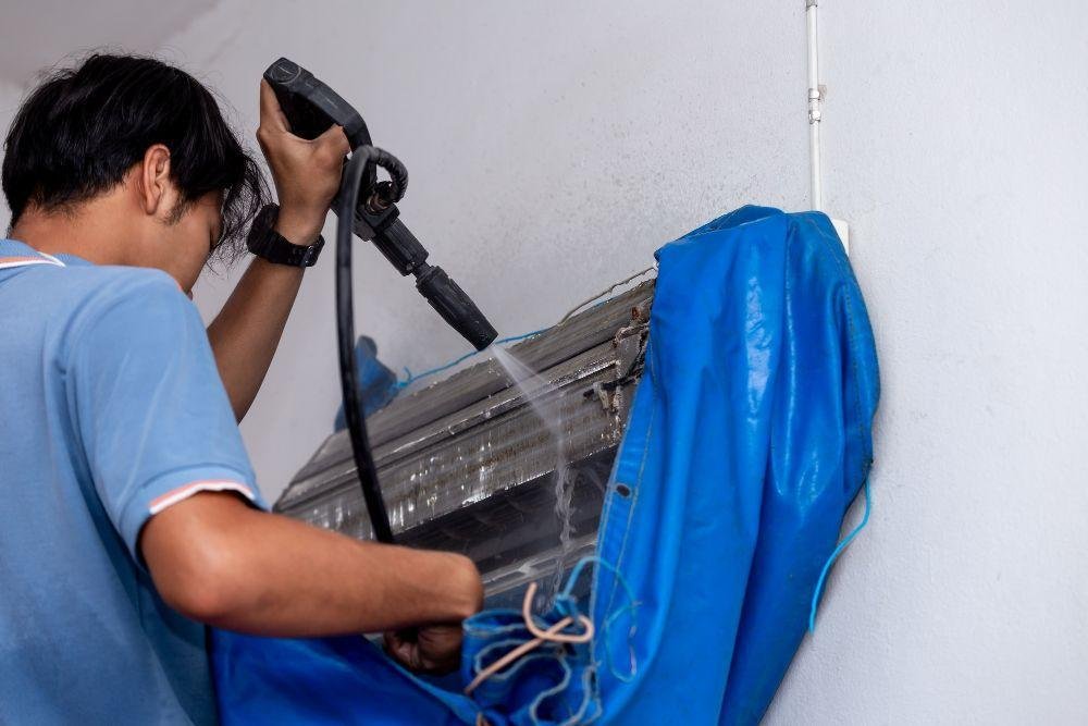 Technician Clean HVAC cleaning system