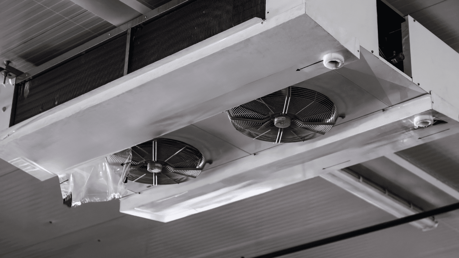 Commercial ceiling mounted HVAC unit with ventilation fans